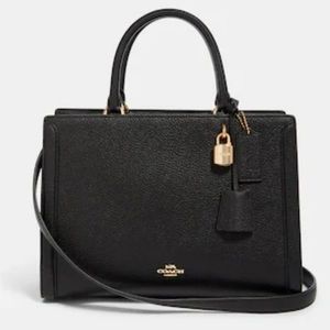 Coach, black leather with gold hardware, lock and key included, 2 inside pockets